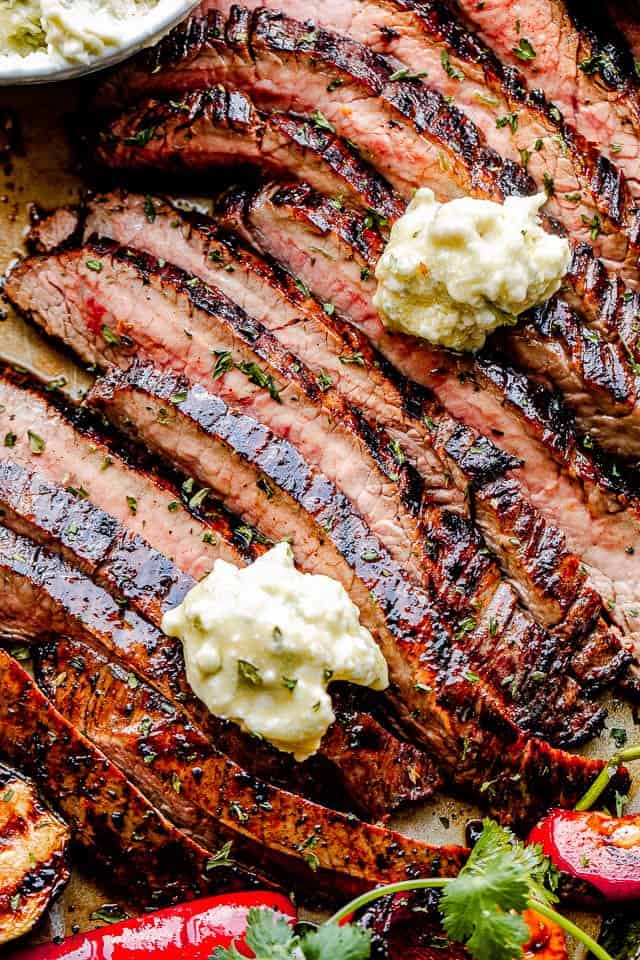 Sliced Grilled Flank Steak and topped with dollops of Bleu Cheese Butter