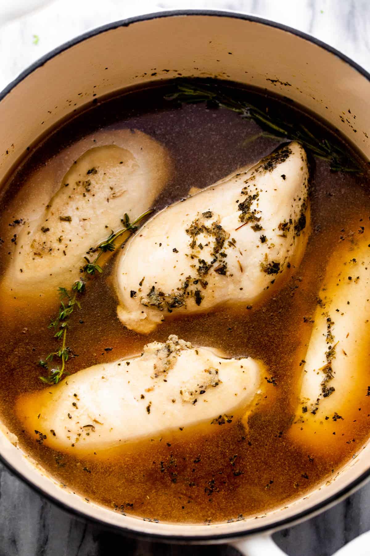 boiled chicken breasts in a dutch oven