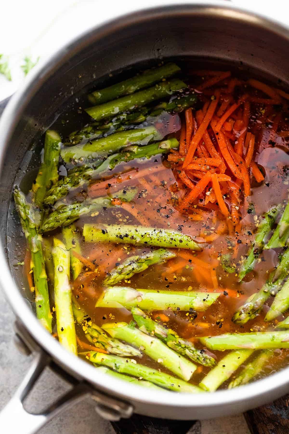 boiling couscous with asparagus and carrots