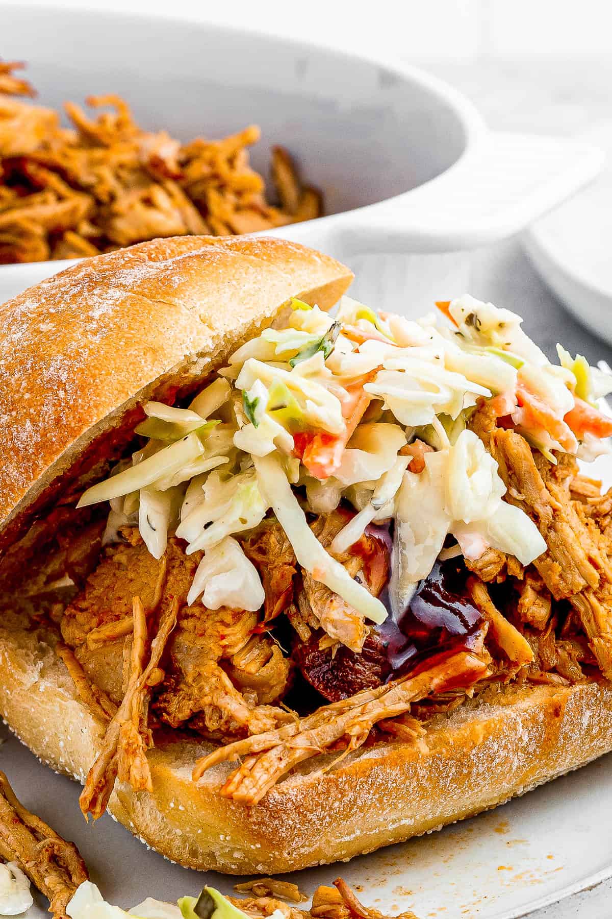 Instant Pot Pulled Pork sandwich topped with coleslaw