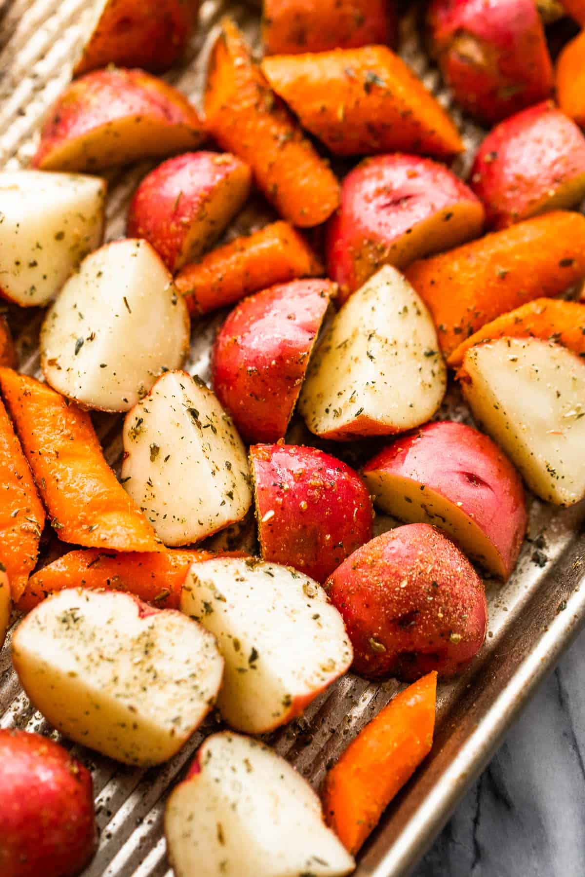 up close shot of cut up carrots and potatoes