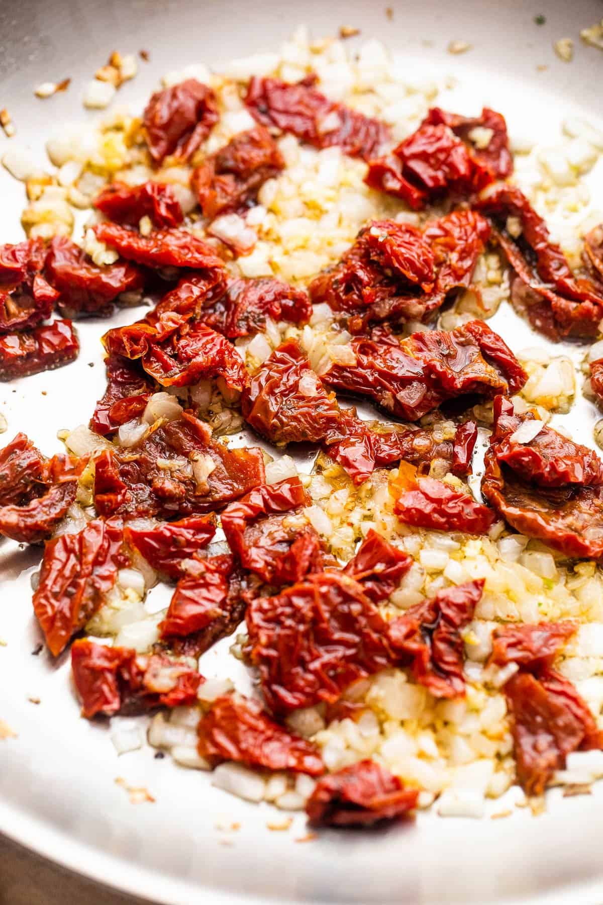 frying sundried tomatoes with diced onions and garlic.