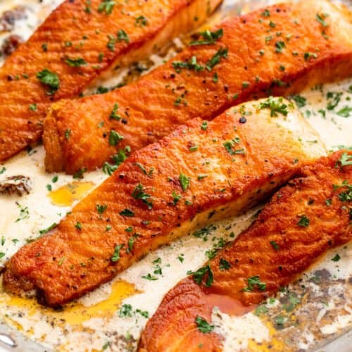 cooking four salmon fillets in cream sauce