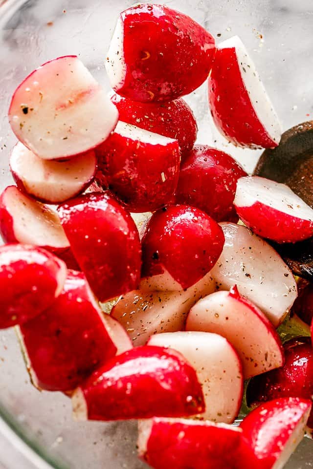 radishes cut in half and tossed with olive oil