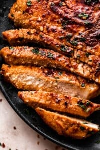 overhead shot of an air fried pork chop cut up into slices.