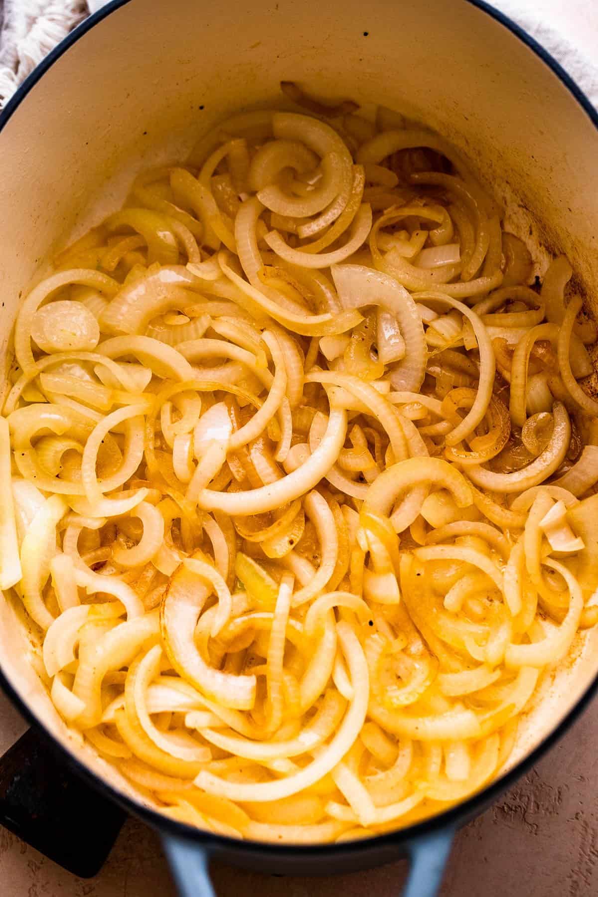 Caramelizing thinly sliced onions in a dutch oven.