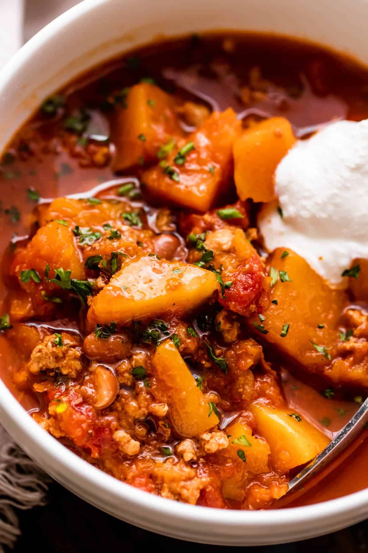 Close-up shot of chili in a soup bowl.