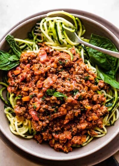 overhead shot of a bowl filled with zoodles and topped with Homemade Bolognese Sauce