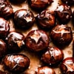 roasted chestnuts on a brown background