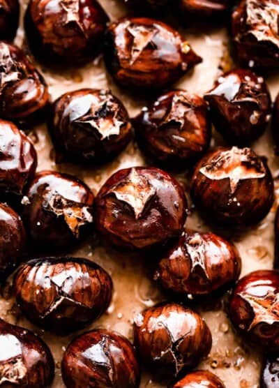 roasted chestnuts on a brown background