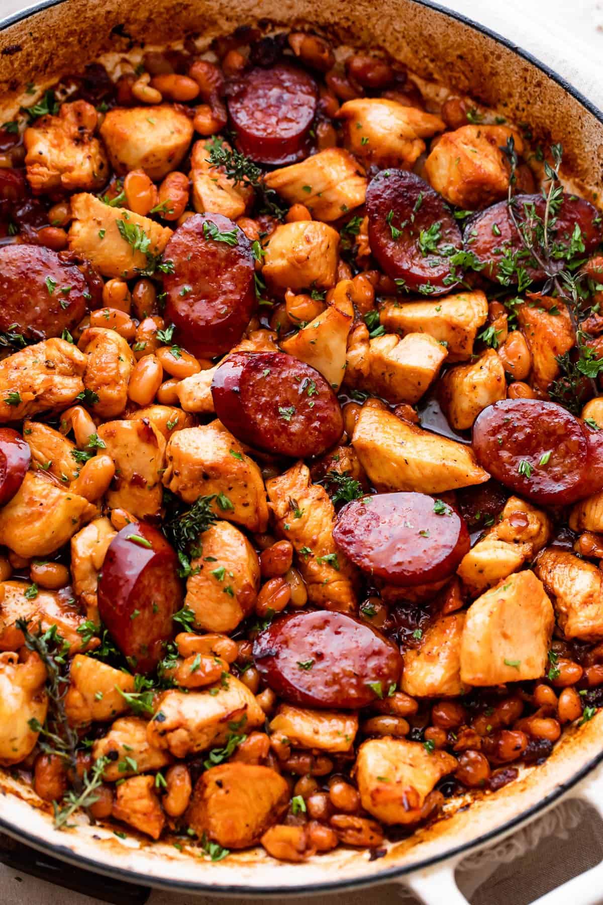 Overhead shot of chicken cassoulet with chicken pieces sausage.