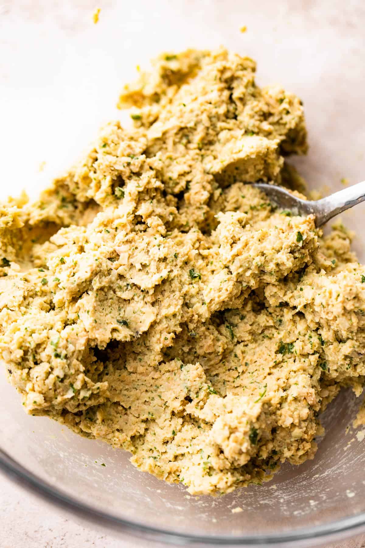 overhead shot of mashed garbanzo beans mixture to make falafels.