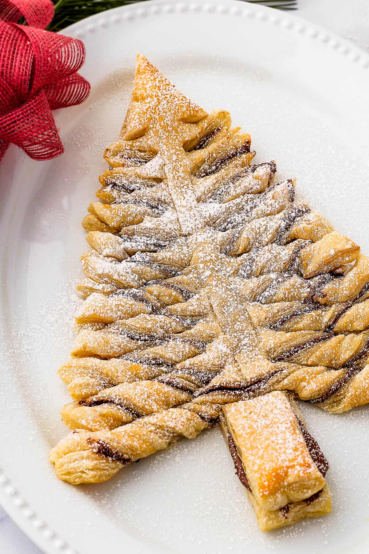 Nutella Puff Pastry Christmas Tree set on a white plate.