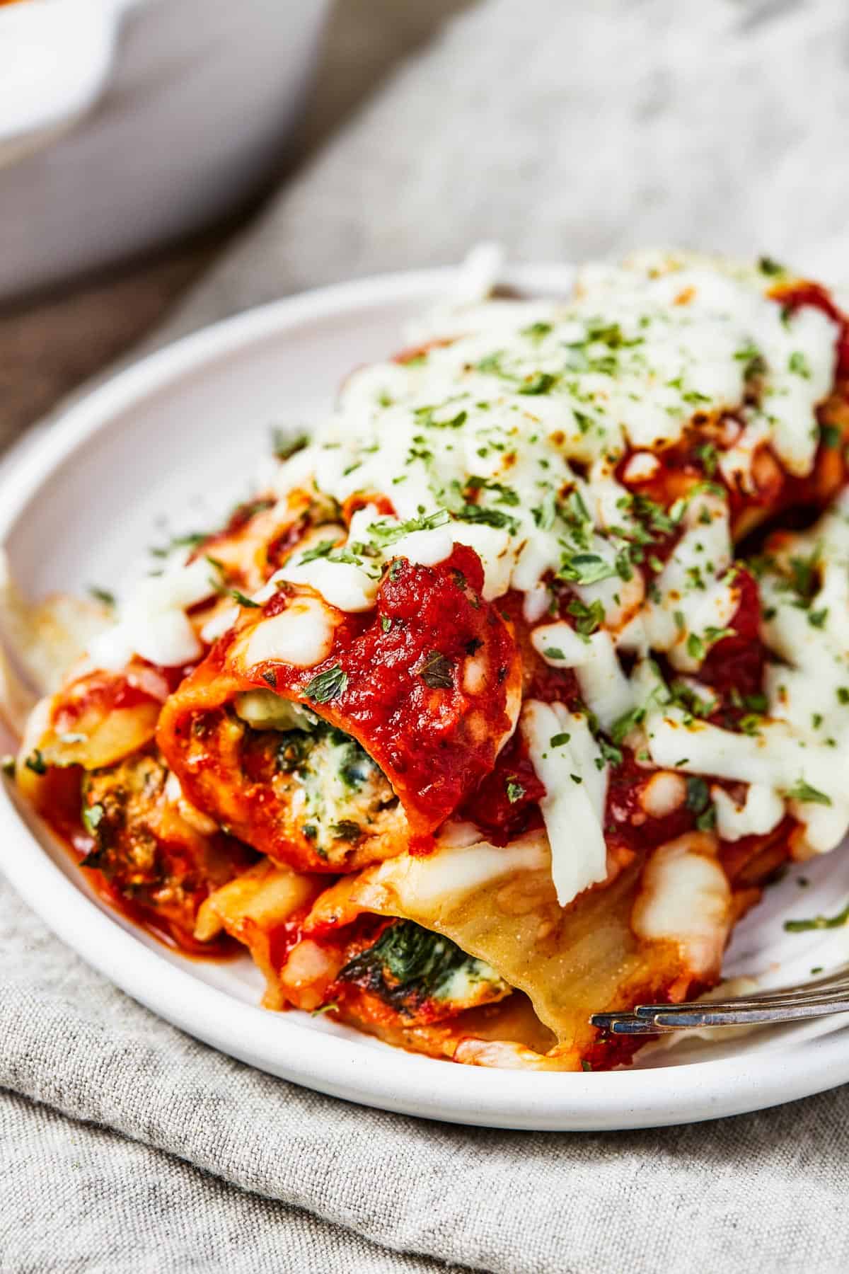 Cheese Manicotti served on a dinner plate.