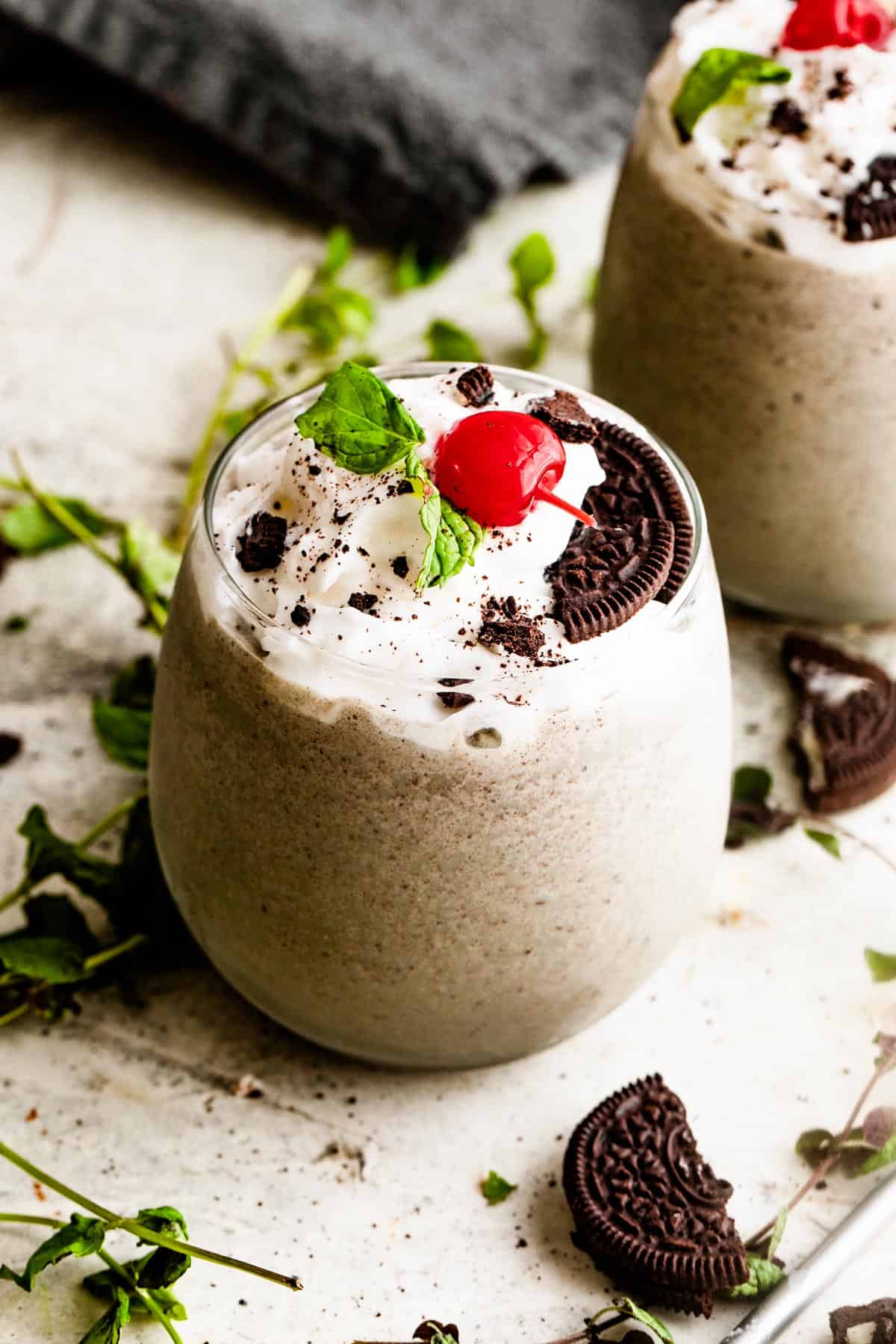 Shamrock Oreo McFlurry served in short glasses and topped with mint and cherries.