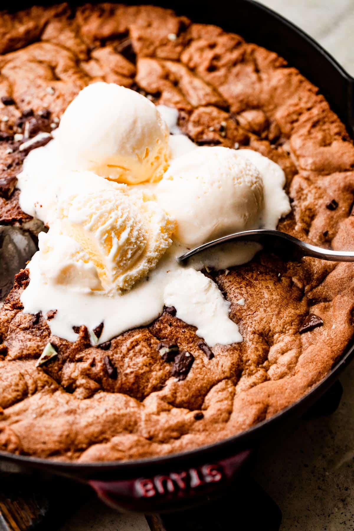 Mint Chocolate Skillet Cookie topped with three scoops of vanilla.