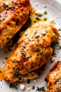 overhead close up shot of three air fryer chicken breasts.