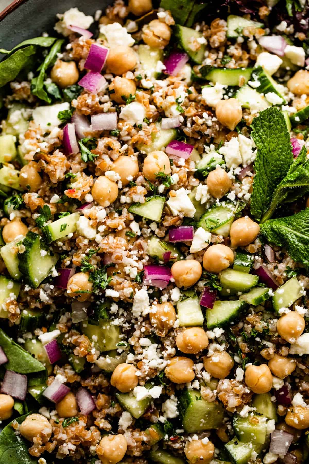 Close-up overhead shot of a serving salad bowl with bulgur salad.