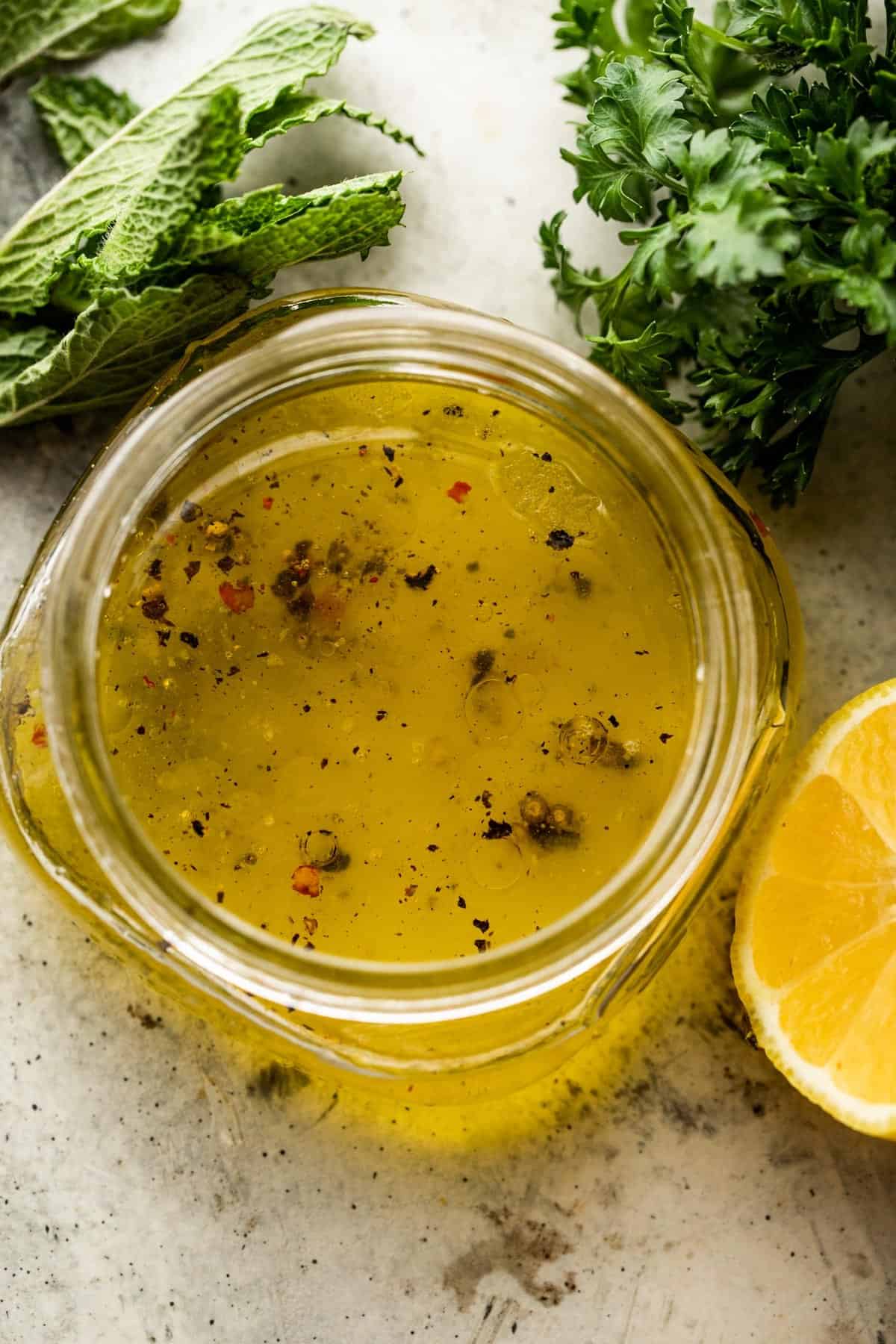 overhead shot of a jar with homemade lemon vinaigrette.