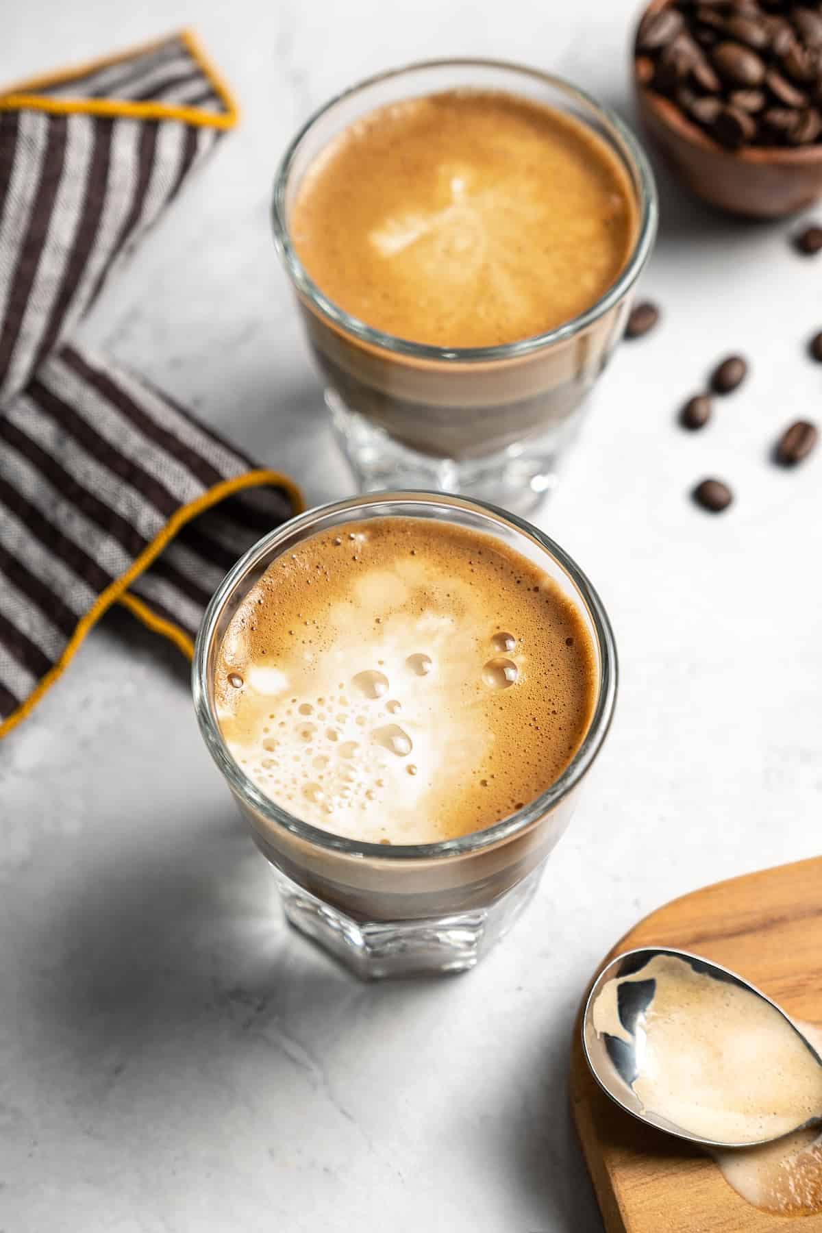Coffee and milk in two glasses