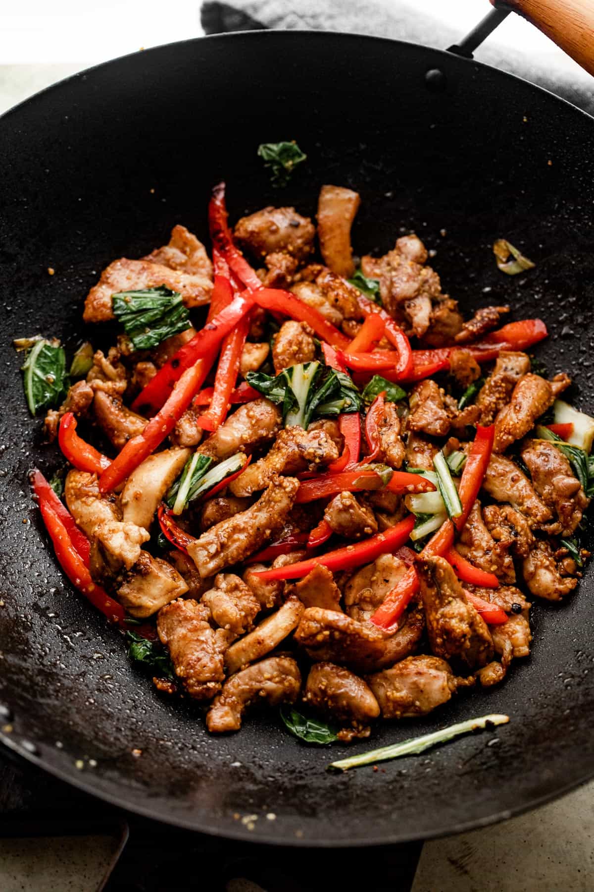 Salt and Pepper Chicken cooking in a black wok.