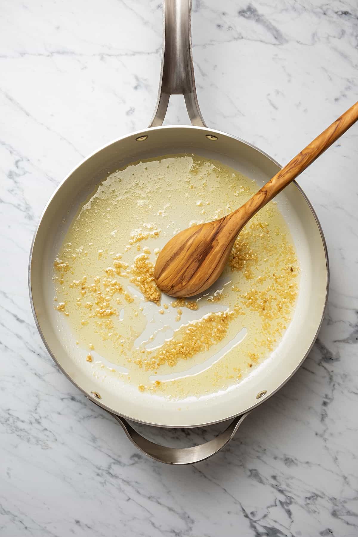 Making shrimp scampi sauce in a skillet