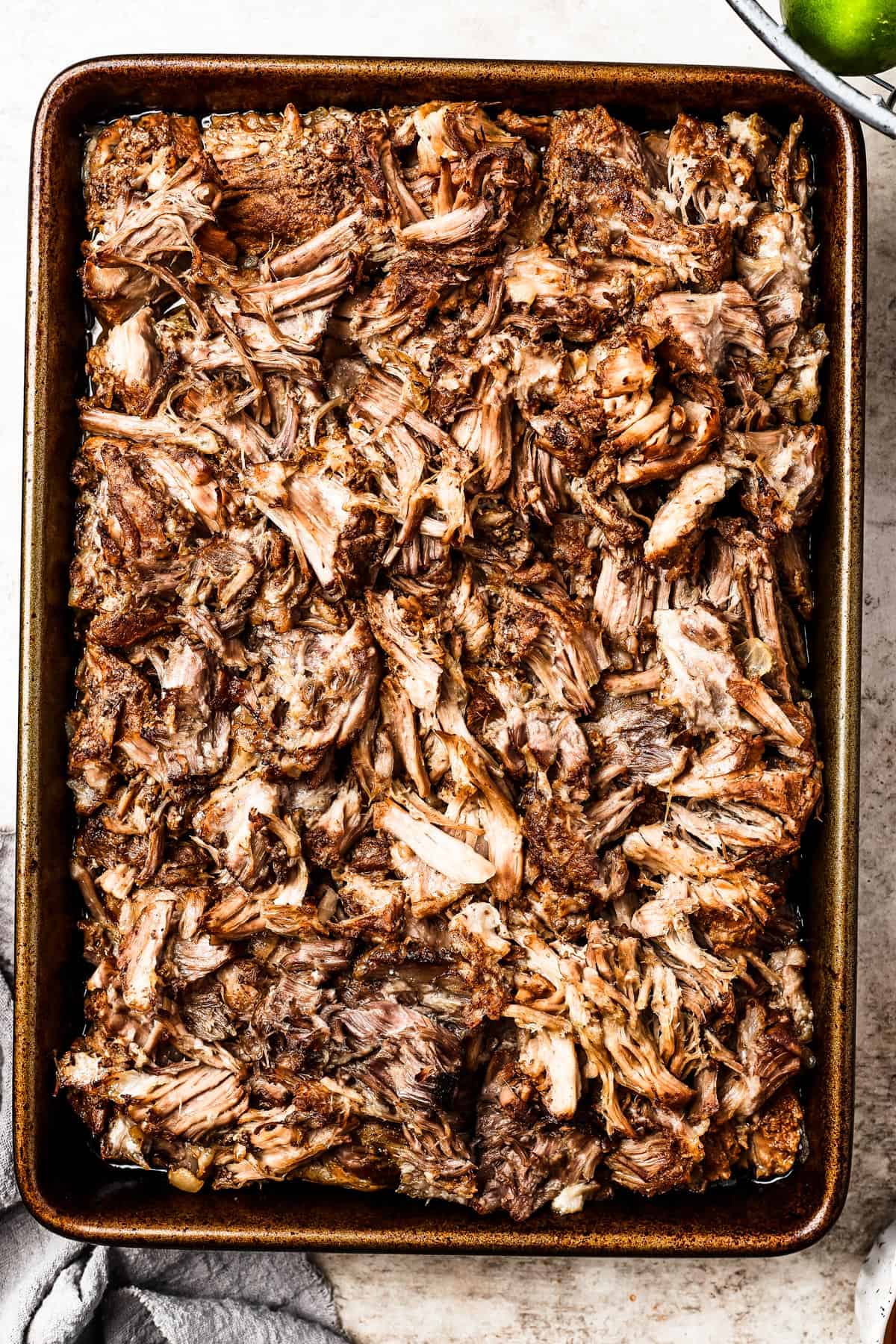 overhead shot of a sheet pan with shredded pork