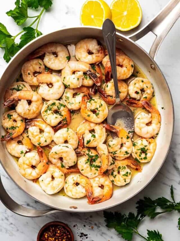 overhead shot of cooked shrimp in a skillet