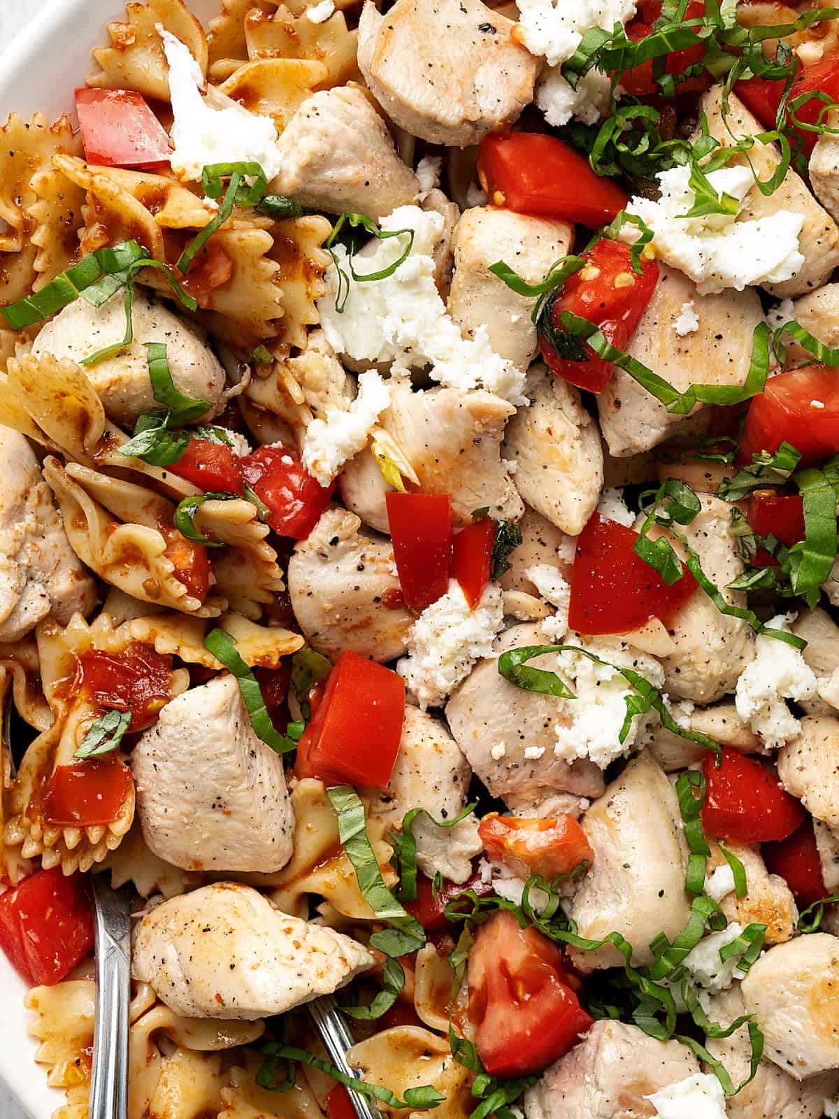 A close-up of Chicken Balsamic Pasta on a platter ready to be served.