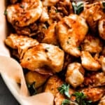 up close shot of air fryer buffalo chicken bites served in a basket with side bowl of blue cheese dressing.