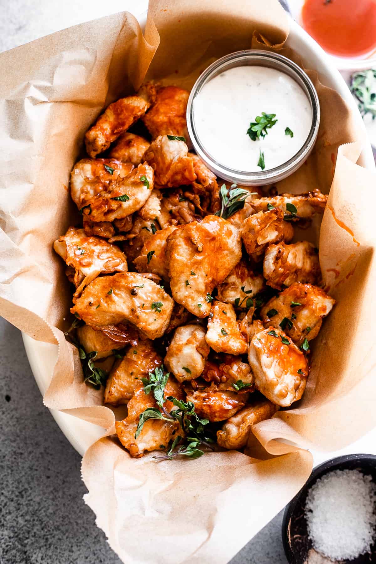 air fryer chicken nuggets served in a basket with side bowl of blue cheese dressing.