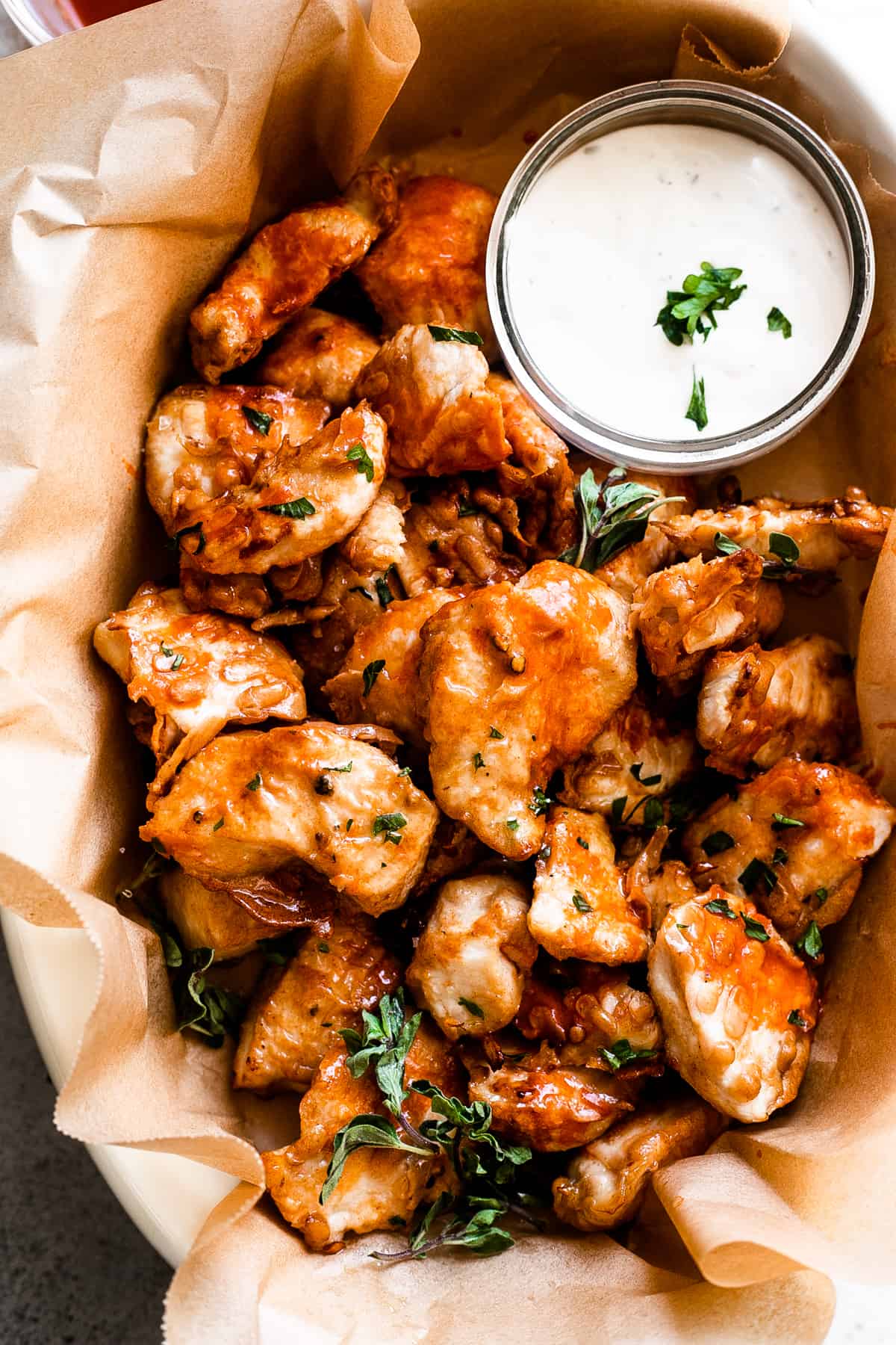 air fryer chicken nuggets served in a basket with side bowl of blue cheese dressing.
