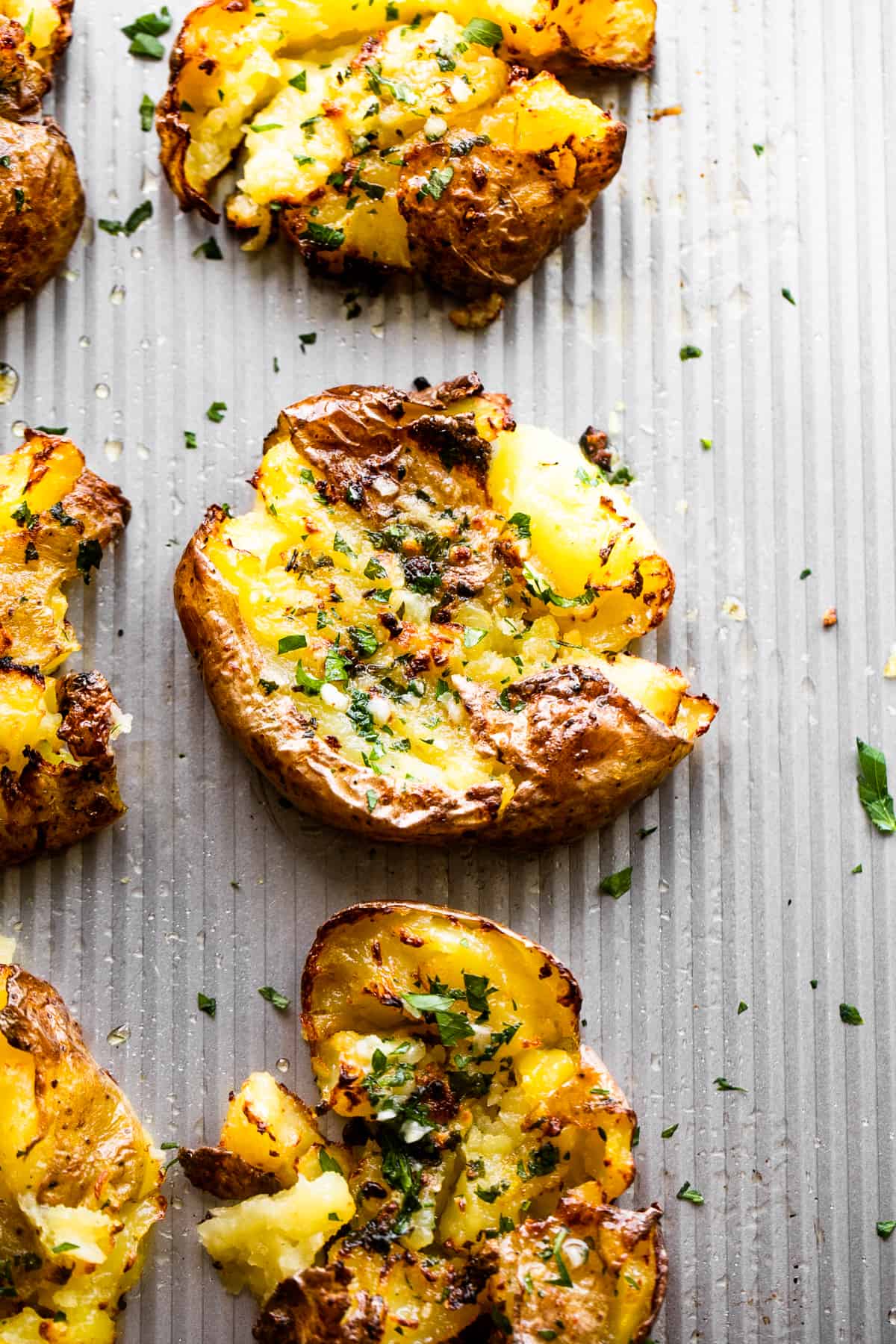 smashed potatoes topped with chopped parsley