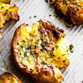 smashed potatoes topped with chopped parsley
