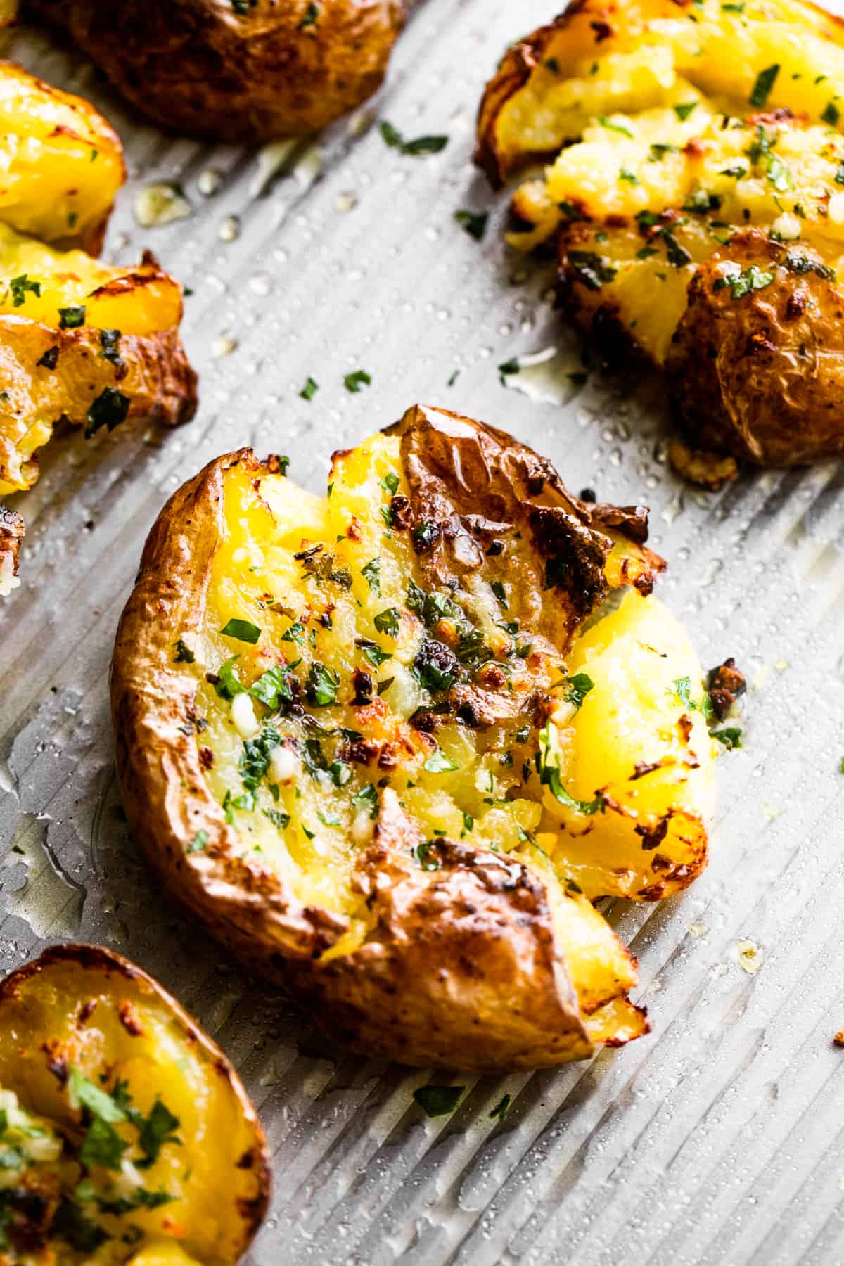 smashed potatoes topped with chopped parsley