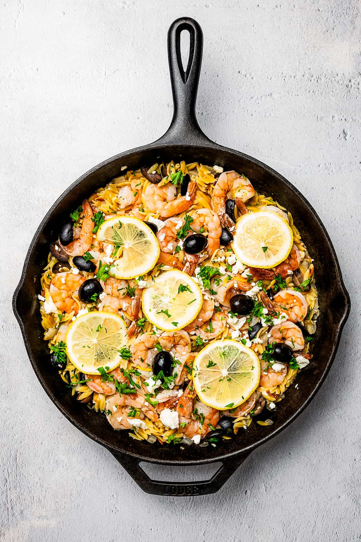 Orzo with shrimp, lemon, olives, and other ingredients.
