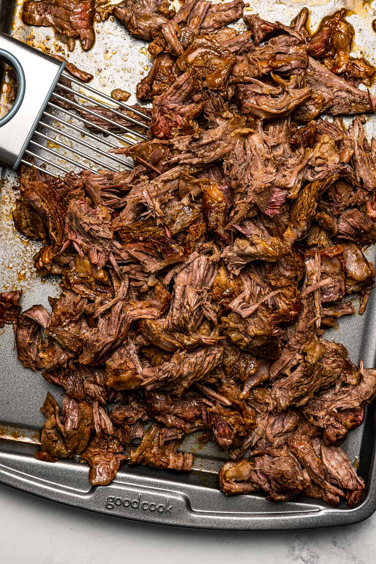 Shredded beef on a tray.