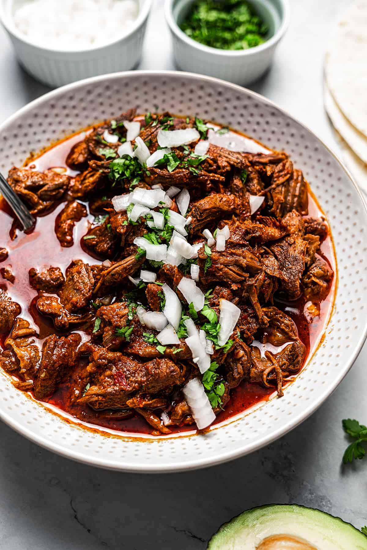Beef birria in a serving dish.