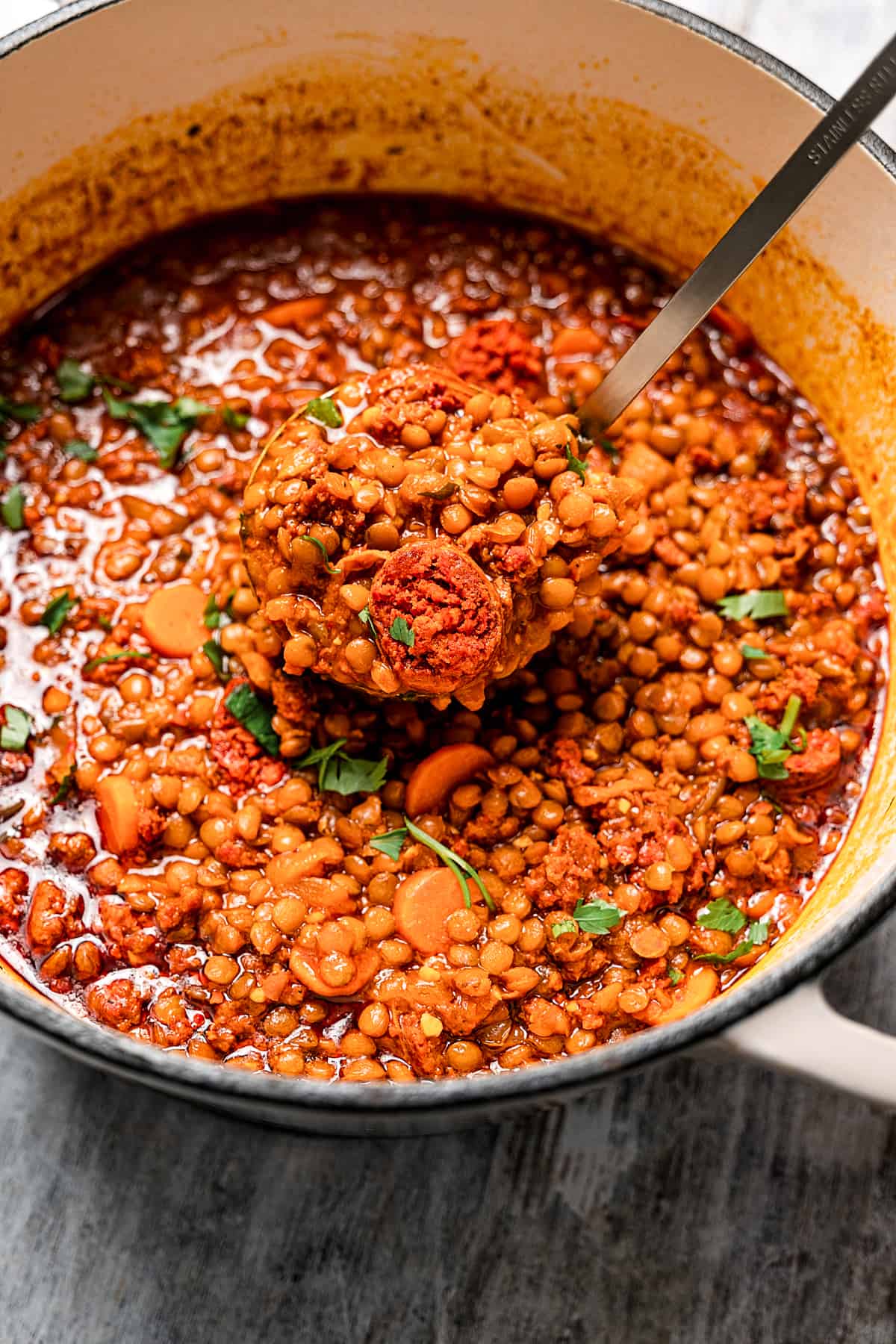 A pot of lentils and other soup ingredients.
