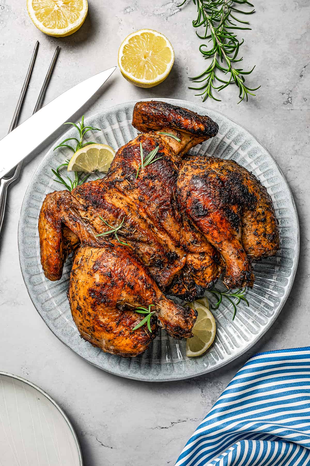 Weekly Meal Plan A whole chicken, seasoned, spatchcocked, and grilled.