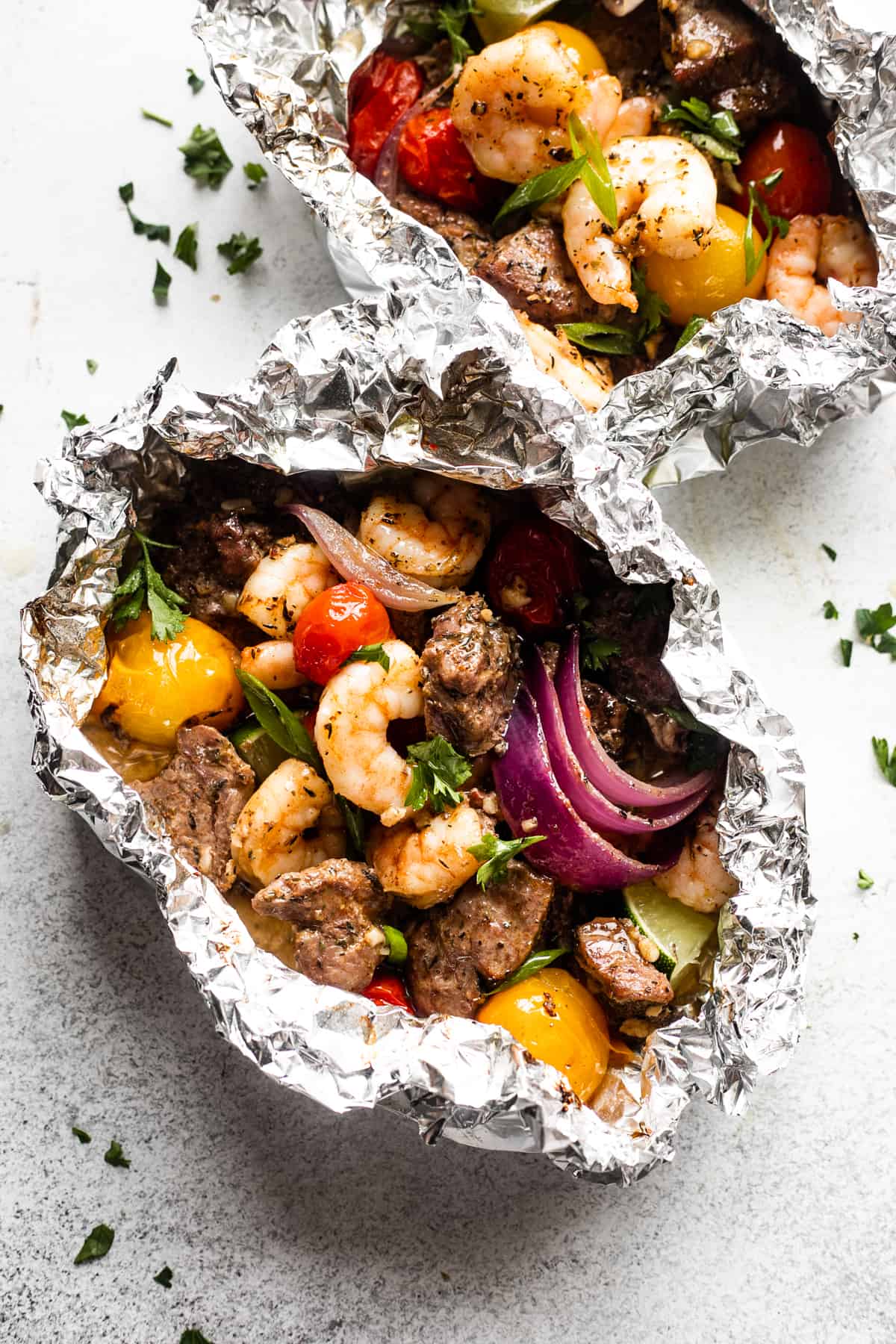 top view of two steak and shrimp packets