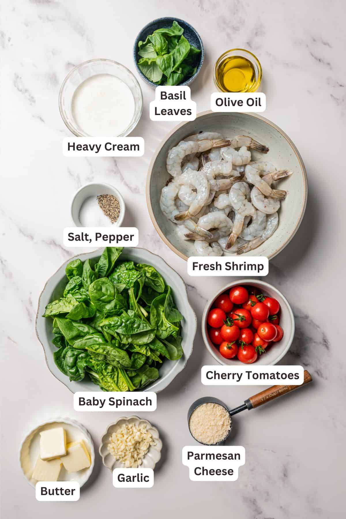Creamy Tuscan shrimp ingredients with text labels overlaying each ingredient.
