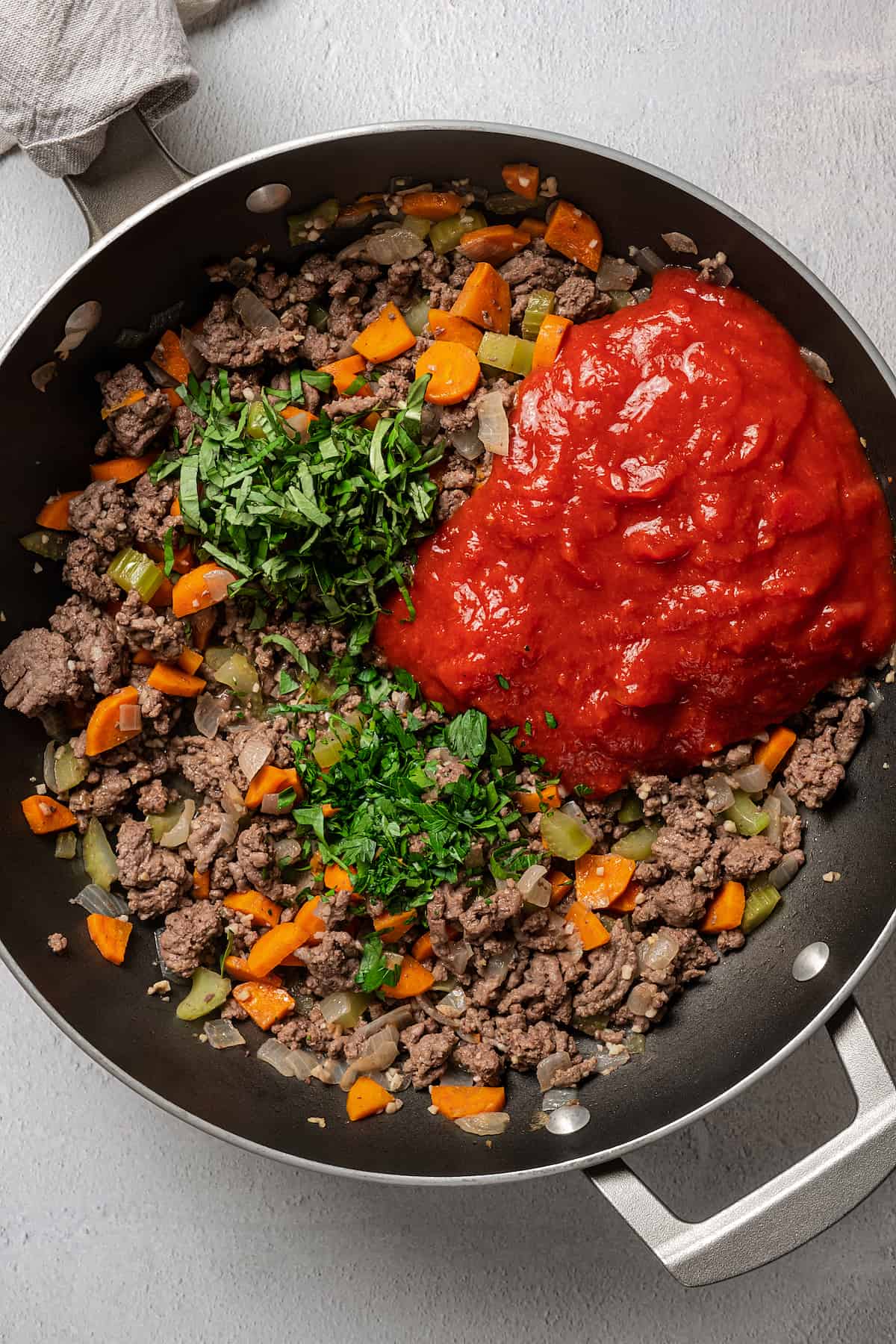 Tomato sauce and other ingredients in a heavy skillet.