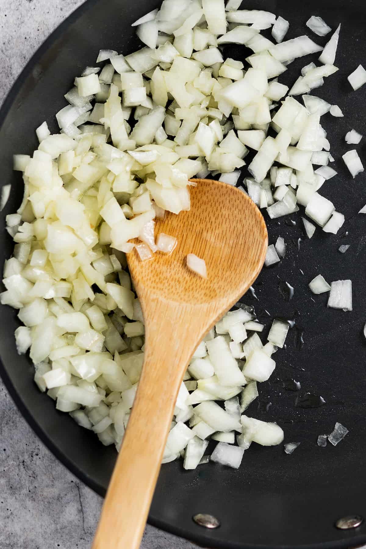 Cooking the onions in the pan.