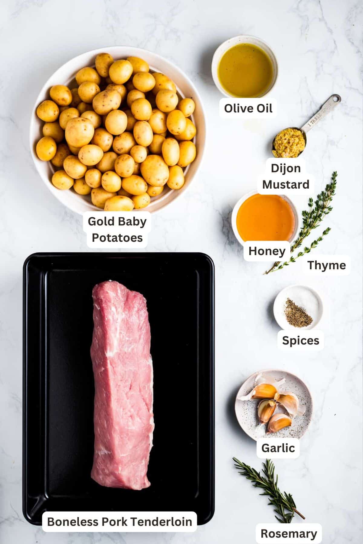 This glazed honey garlic pork tenderloin recipe with potatoes is an easy holiday dinner! Fresh herbs, honey, and tangy Dijon are the secret. Ingredients for Honey Garlic Pork Tenderloin.