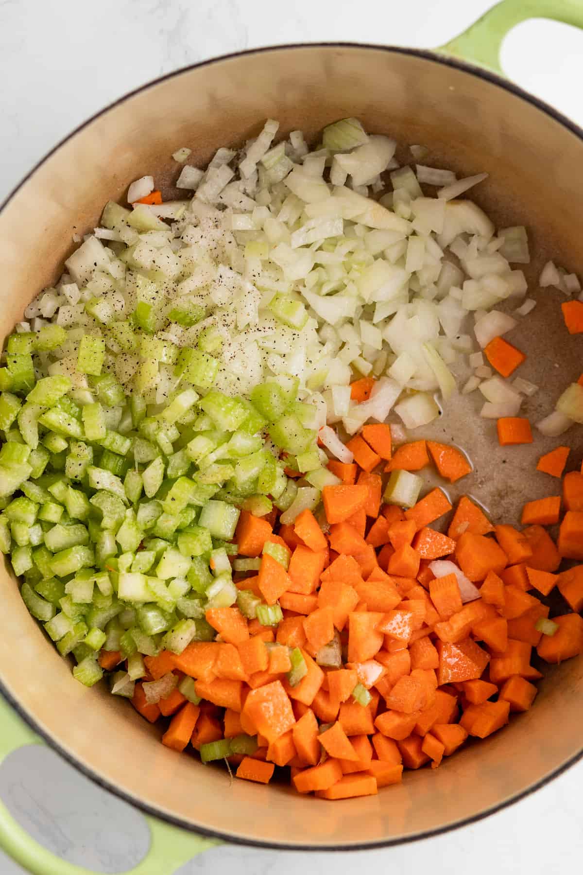 Adding the veggies to the pot. 