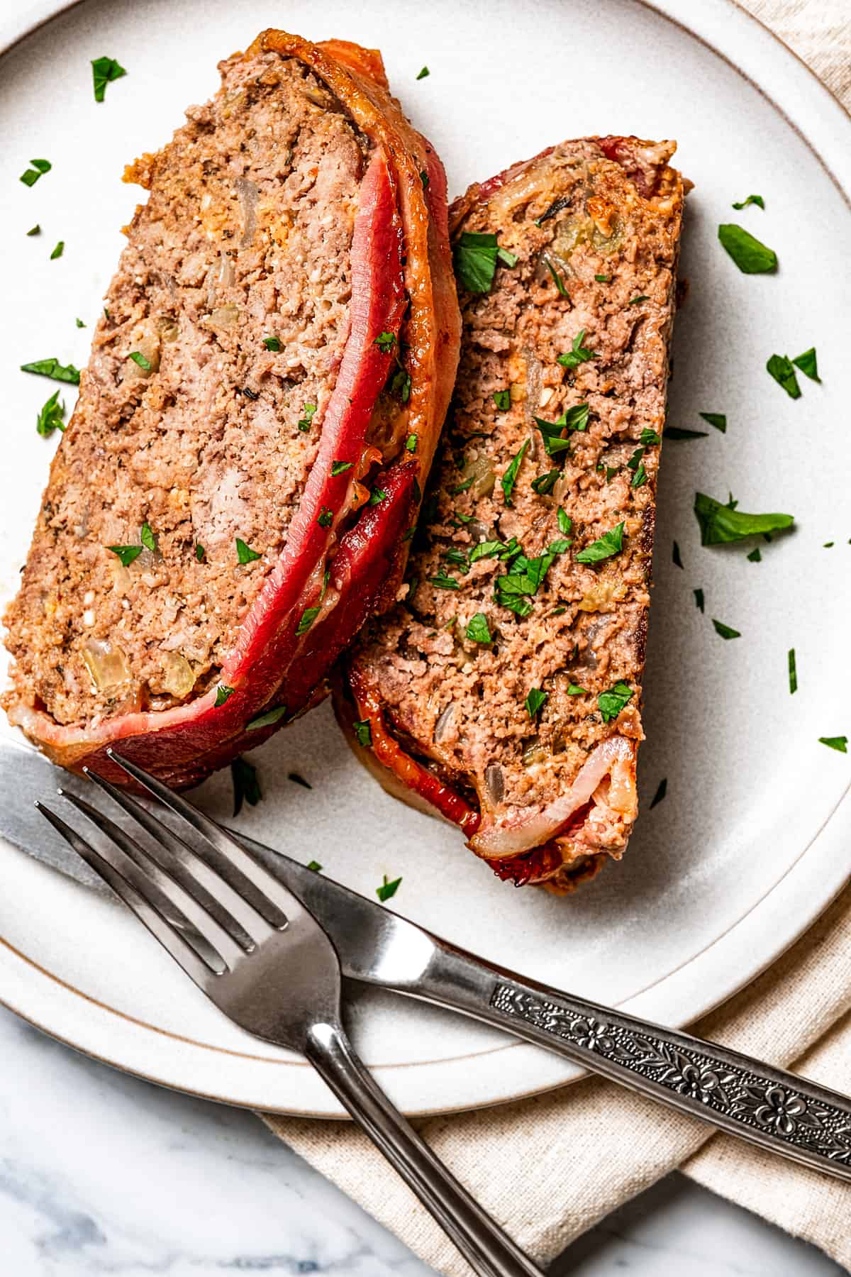 A plate with two slices of keto meatloaf.
