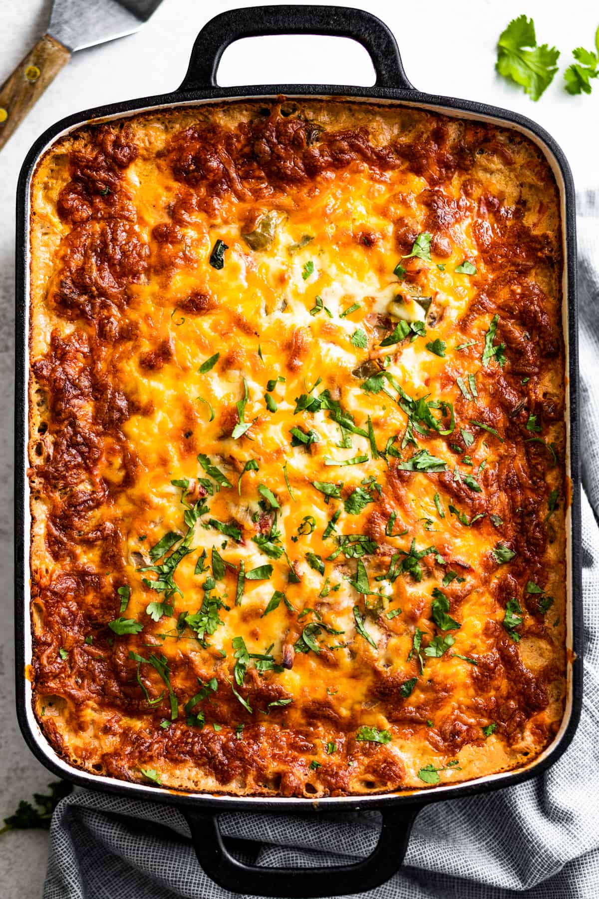 King Ranch chicken in the baking dish with chopped cilantro.