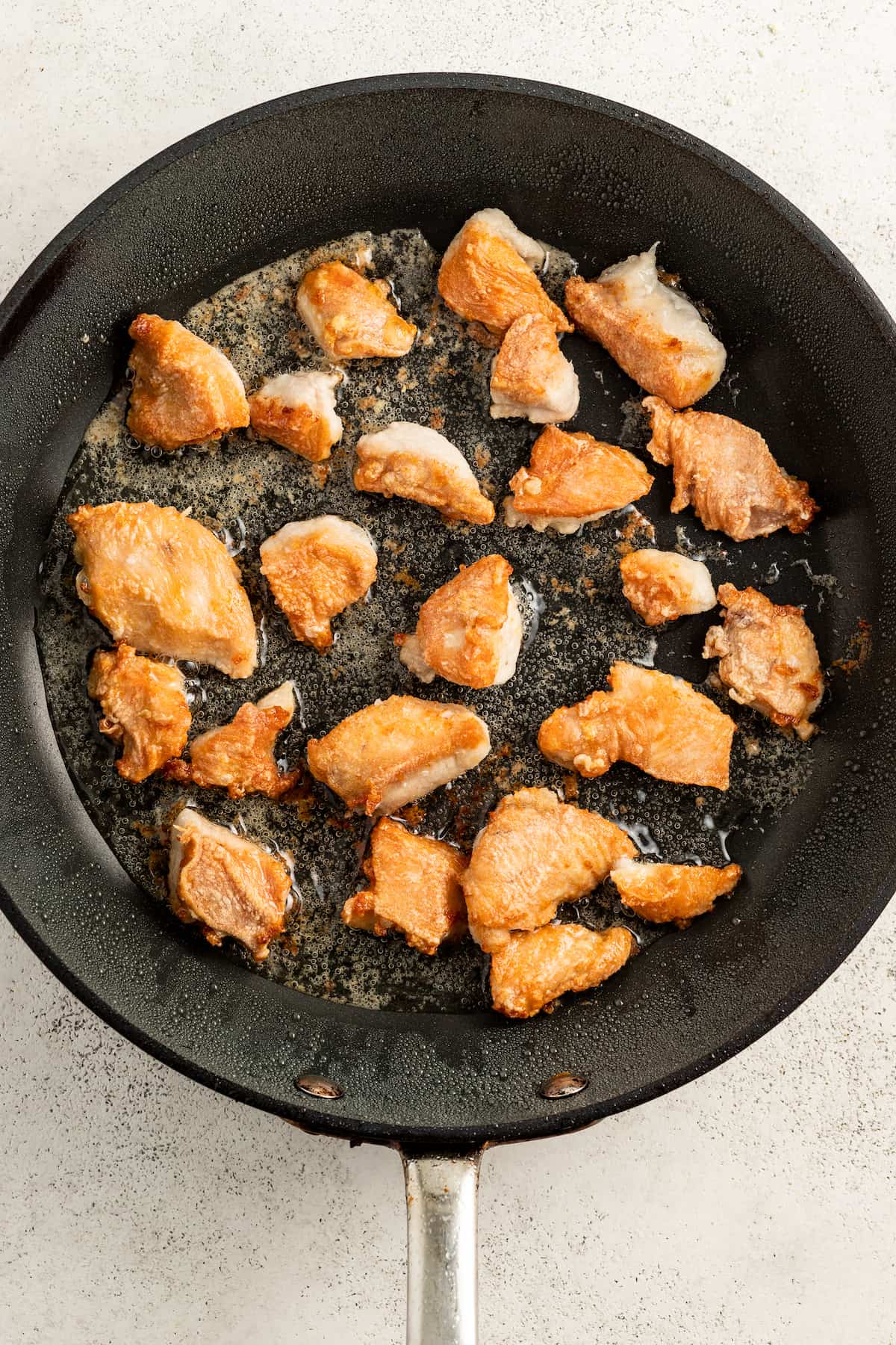 Frying the chicken.