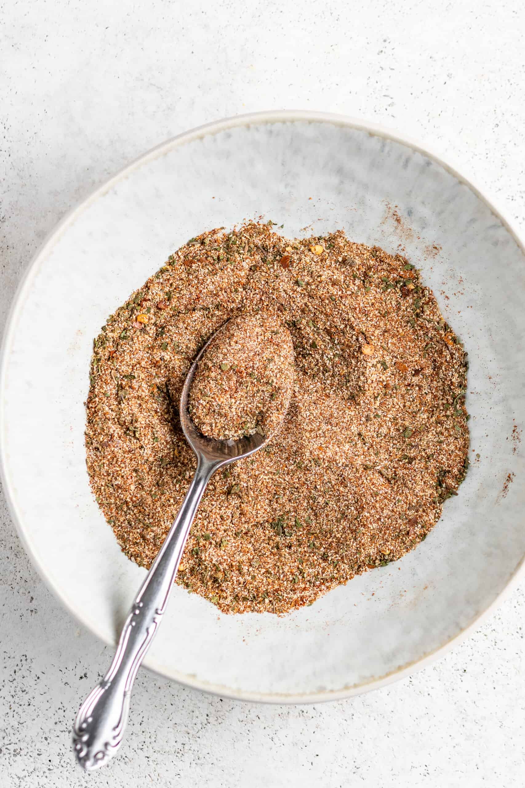 Homemade jerk seasoning in a small bowl.